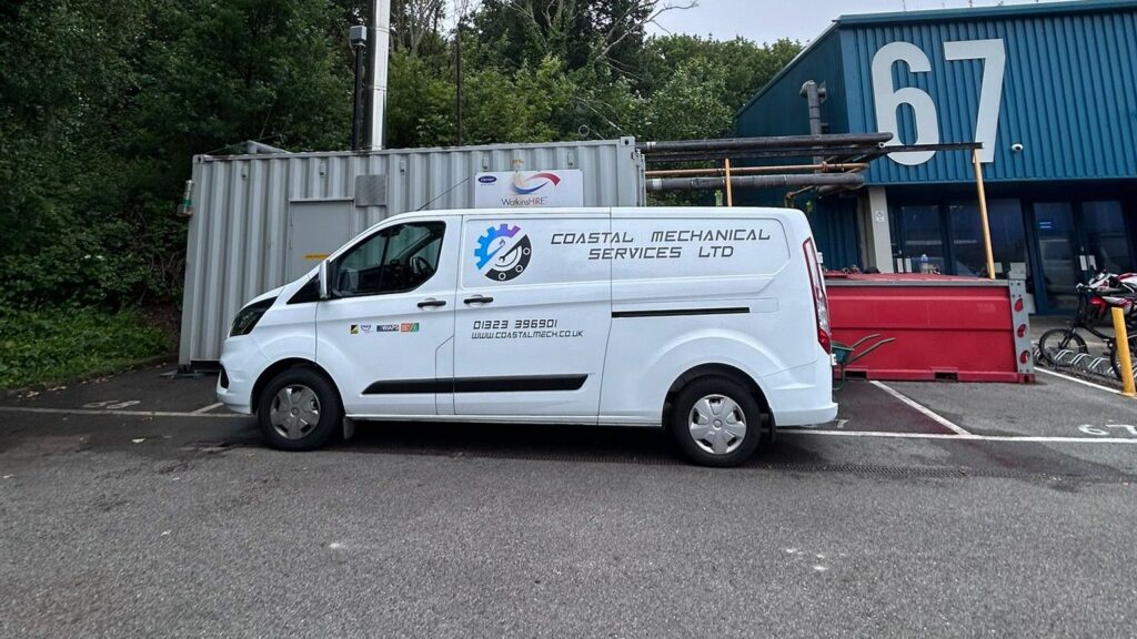 Coastal Mechanical Services Ltd van parked on site alongside a temporary boiler container