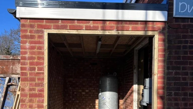 Boiler plant installed inside a brick external boiler house with the doors open