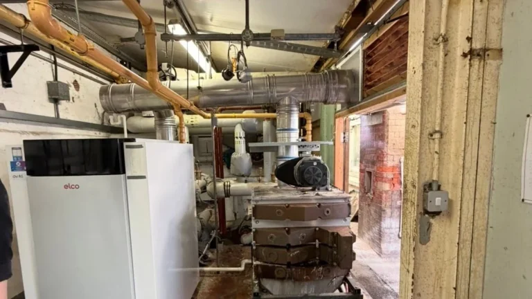 Floor-standing commercial boiler and gas pipework installed in an existing plant room