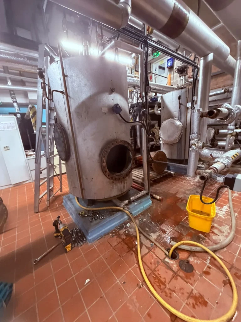 Steam boiler and associated pipework being stripped out during a commercial plant room replacement