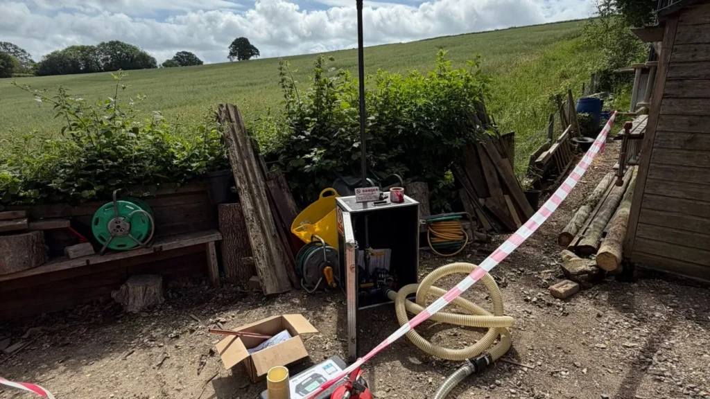 Cordoned excavation and equipment set up on site during an emergency gas leak repair