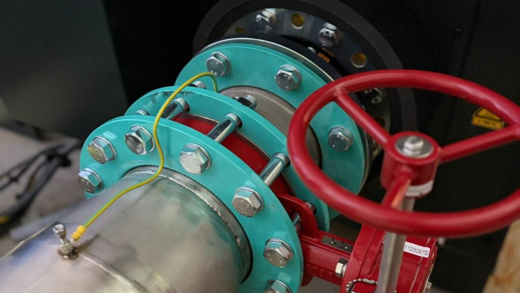 Flanged gate valve with gearbox actuator installed on a large-bore mechanical services main
